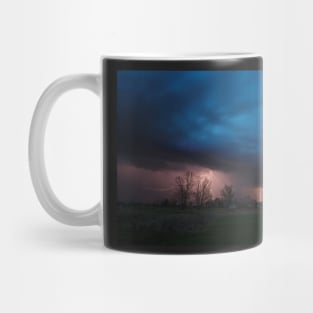 Multiple lightning strikes under dramatic cloudy sky Mug